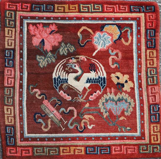 A Tibetan square sitting rug, late 19th/early 20th century, 80cm x 80cm